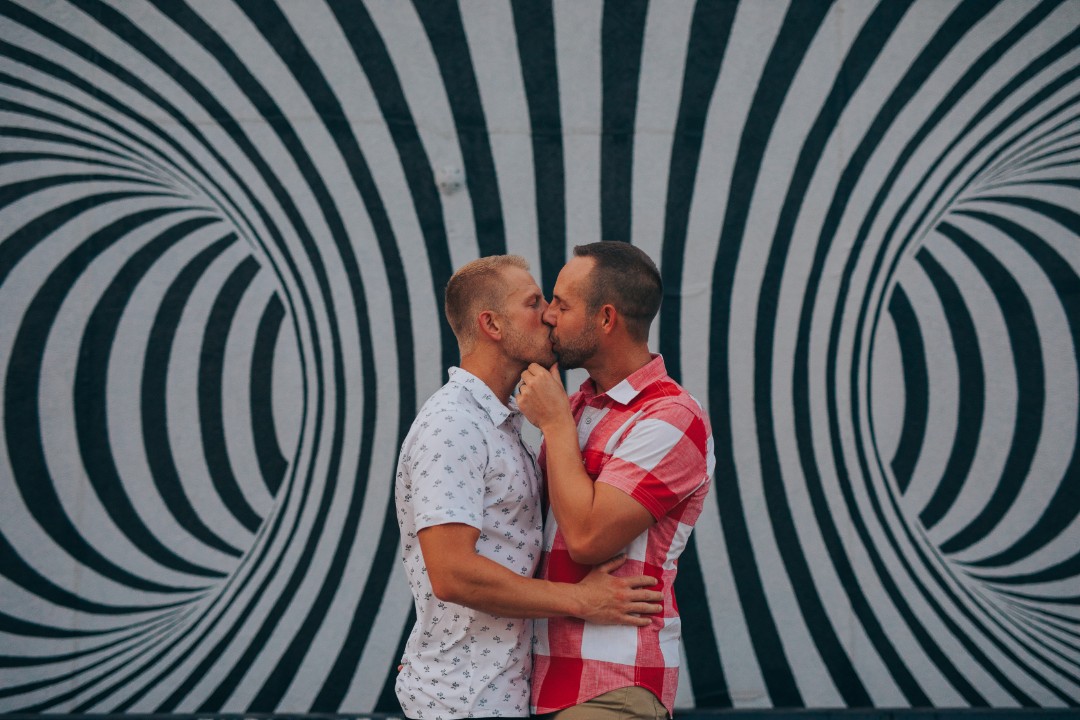 Unique engagement shoot idea #8: Make that cool graffiti wall in your neighborhood your new backdrop!