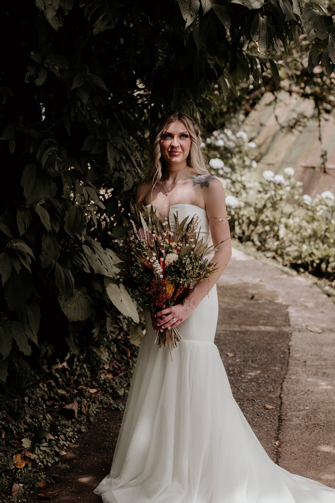 Both brides rocked a dried floral bouquet for their destination elopement.