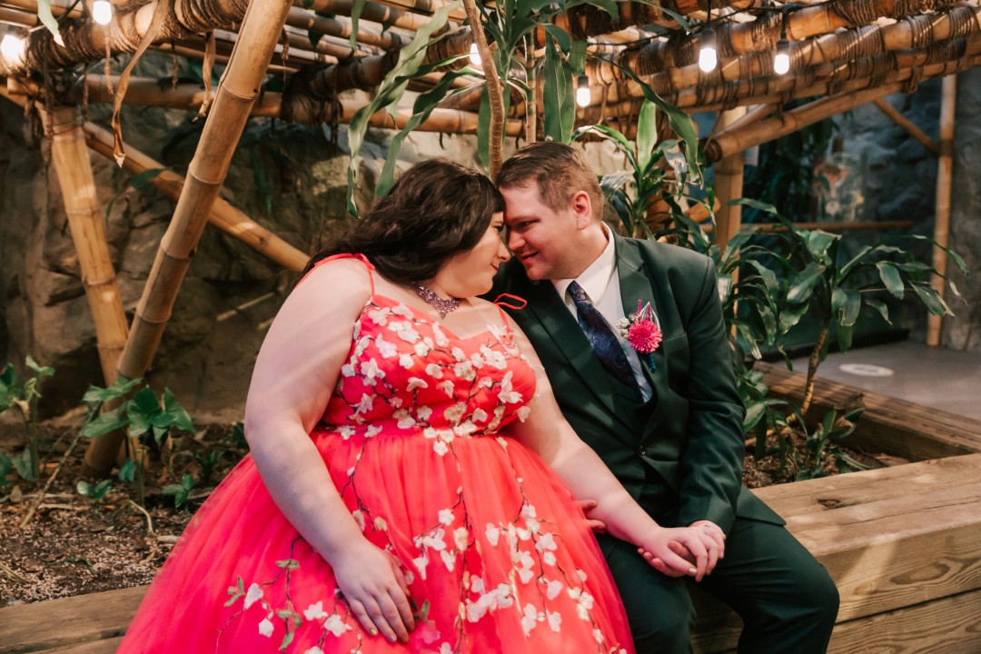 Because Franklin Park Zoo has beautiful shades of greenery and bamboo accents surrounding the animal habitats, we also got to take some stunning couples portraits on the grounds. I even caught a hippo in the background of one of my shots!